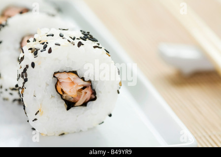 Maki sushi rolled in black sesame seeds, close-up Stock Photo