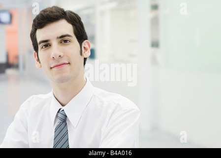 Businessman confidently looking at camera, portrait Stock Photo