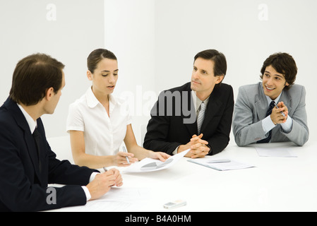 Business people in meeting listening to presentation Stock Photo
