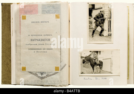 Photo Albums of First Lieutenant Sander in the 1st Don Cossack Cavalry Regiment., Assembled and notated by his brother after the war (Sander fell in April 1945) with numerous newspaper clippings, leave passes, identity documents, letters and so forth. Included are the award documents for the Ostvolk Bravery Medal 2nd Class in Silver (2 December 1943, original signature v. Pannwitz, the blank reverse in Cyrillic), the Iron Cross 2nd Class of 1939 (16 November 1943, original signature Dehner), the General Assault Badge (10 August 1944), the Wound Badge in Black (, Stock Photo