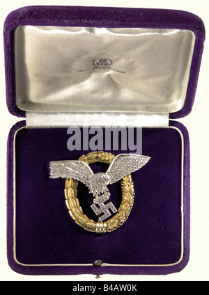 Generalfeldmarschall Hugo Sperrle, Supreme Commander of Luftwaffenkommando West., A Combined Pilots and Observers Badge in Gold with Diamonds, in its original case of issue. The oak leaf and laurel wreath in gold, the cambered eagle and the swastika are silver, in open work set with more than 170 diamonds, assembled with two slit nuts on soldered threaded pins. The swastika pinned to the ribbon binding at the bottom of the wreath. The pin with a roller hinge and a safety catch. Weight 30.70 g, 51.55 x 60.19 mm. The extremely rare case covered and lined with pur, Stock Photo