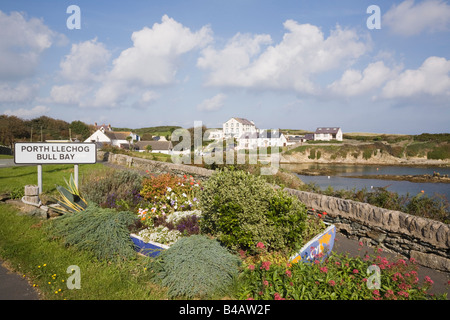 'Bull Bay' Porth Llechog Anglesey North Wales UK September Coastal village with place name sign and flowers by small bay in AONB Stock Photo