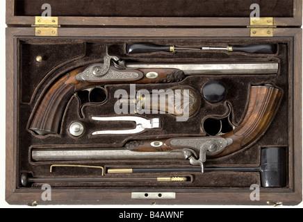 A cased pair of target pistols, Hermite à Saumur, circa 1840. Octagonal barrels with patent breeches, ten groove rifled bores in 12 mm calibre. Maker's signature engraved on top of the barrels. Locks are decorated with fine arabesque engraving. Beautifully figured, carved walnut half stocks. Engraved iron furniture. Length of each 43 cm. In a matching lockable case, lined with green velvet. Comprehensive and complete set of accessories with powder flask, nipple wrench, screwdriver, bullet mold, loading hammer, and cleaning rod. Dimensions 50 x 30 x 7 cm. histor, Stock Photo