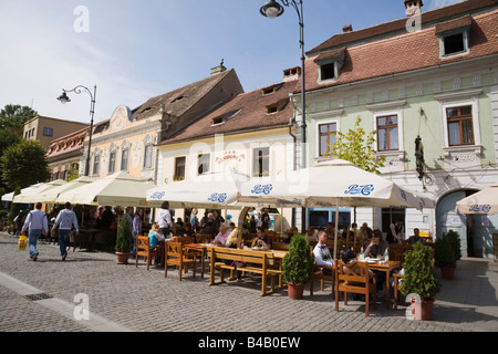 Sibiu Transylvania Romania Street cafes with umbrellas and outdoor seating on pedestrian precinct in historic city centre Stock Photo