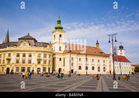 Sibiu Transylvania Romania. Roman Catholic church and old buildings in Piata Mare pedestrianised square in historic city centre Stock Photo