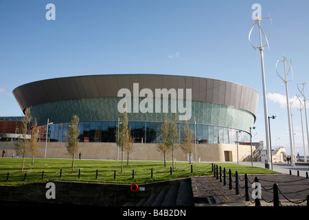 The Liverpool Echo Arena and BT conference centre near Albert Dock on the banks the River Mersey with wind generators Stock Photo