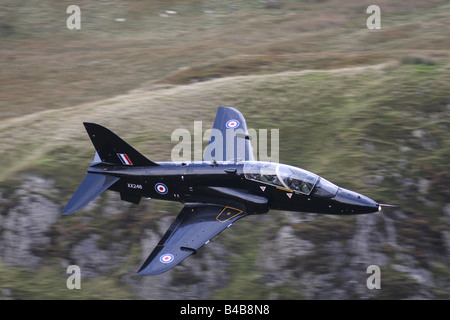 An RAF fighter jet low flying over the lake district fells, Cumbria, UK ...