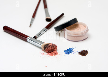 Makeup set for the eyes with eyeshadows and different brushes isolated Stock Photo