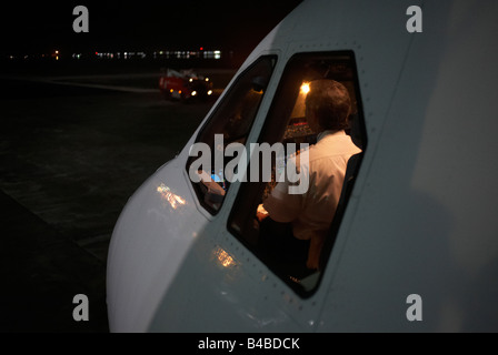 The captain of a Sri Lankan Airlines A340-300 series Airbus prepares his aircraft for departure to Colombo Stock Photo