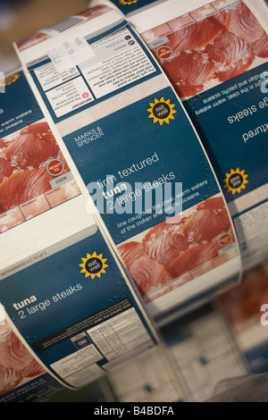 A roll of sticky labels for tuna steaks lie in stationery cupboard destined for the shelves of retail chain Marks & Spencer Stock Photo