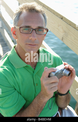 Outdoor Portrait of a Man in a Wheelchair He is Wearing a Green Golf Shirt Copy Space Stock Photo