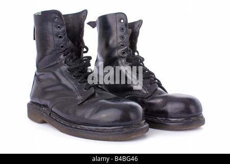 Old black leather work boots isolated on white background Stock Photo