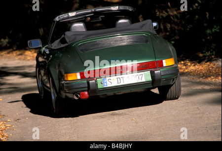 Car, Porsche 911 SC Convertible, model year 1983-1989, this vehicle: model year 1985, open top, dark green, FGUJ, driving, diago Stock Photo