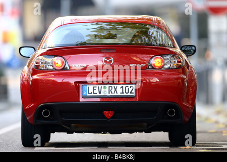 Car, Mazda RX 8, roadster, model year 2002-, red, coupe/Coupe, FGHDS, standing, upholding, rear view, City Stock Photo
