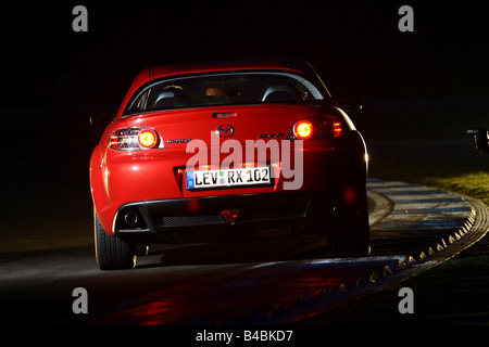 Car, Mazda RX 8, roadster, model year 2002-, red, coupe/Coupe, FGHDS, standing, upholding, rear view, test track, Night admissio Stock Photo