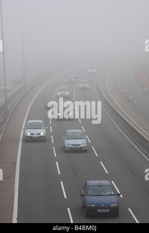 Traffic in fog on the M1 motorway in Nottinghamshire, England, U.K. Stock Photo
