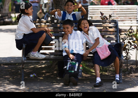 School children play after school in the town square before going home Granada Nicaragua Stock Photo