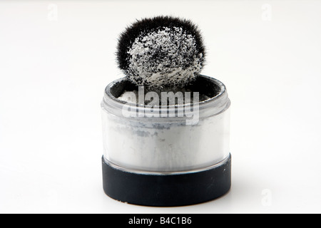 Translucent white powder in a jar and on brush isolated Stock Photo