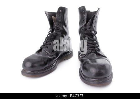 Old black leather work boots isolated on white background Stock Photo