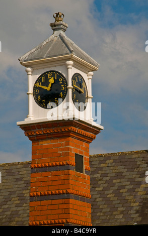 Red brick clock tower in the middle of the welsh town of Usk in Monmouthshire Stock Photo