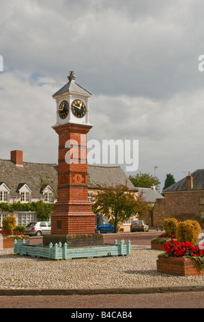 Red brick clock tower in the middle of the welsh town of Usk in Monmouthshire Stock Photo