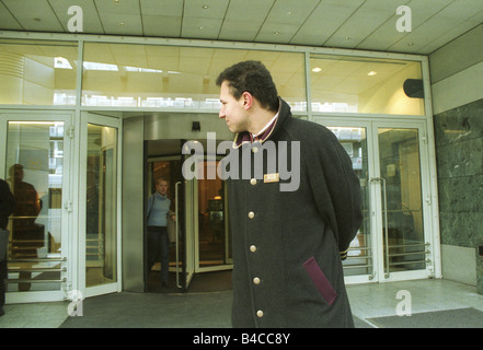 A doorman in front of the entrance to the Sheraton Hotel, Warsaw, Poland Stock Photo