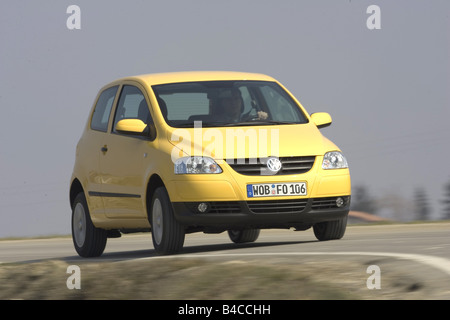 Car, VW Volkswagen Fox, model year 2005-, yellow, Miniapprox.s, Limousine, driving, diagonal from the front, frontal view, count Stock Photo