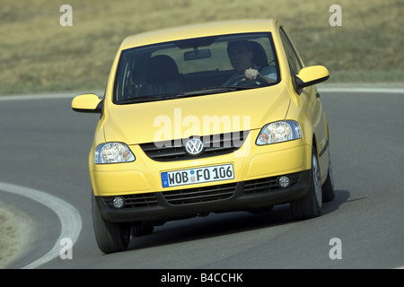 Car, VW Volkswagen Fox, model year 2005-, yellow, Miniapprox.s, Limousine, driving, diagonal from the front, frontal view, count Stock Photo