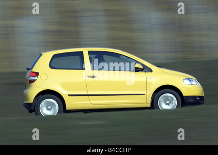 Car, VW Volkswagen Fox, model year 2005-, yellow, Miniapprox.s, Limousine, driving, side view, country road, photographer: Achim Stock Photo