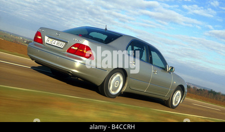 Car, Lexus LS 430, Limousine, Luxury approx.s, model year 2001-, silver, driving, country road, diagonal from the back, Rear vie Stock Photo
