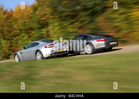 Sports approx.s group picture: Porsche 911 Carrera S, model year 2005-, silver/anthracite, Aston Martin V8 Vantage, Year of cons Stock Photo