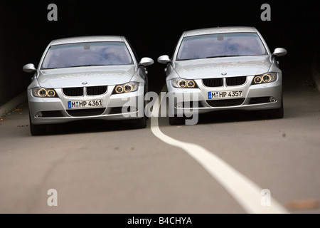 BMW 318i/d, model year 2004-, silver, driving, diagonal from the front, frontal view, country road, group picture Stock Photo