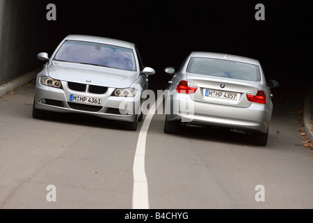 BMW 318i/d, model year 2004-, silver, driving, frontal view, rear view, country road, group picture Stock Photo