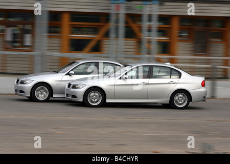 BMW 318i/d, model year 2004-, silver, driving, side view, group picture Stock Photo