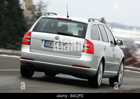 Skoda Octavia RS Combi, model year 2005-, silver, driving, diagonal from the back, rear view, country road Stock Photo