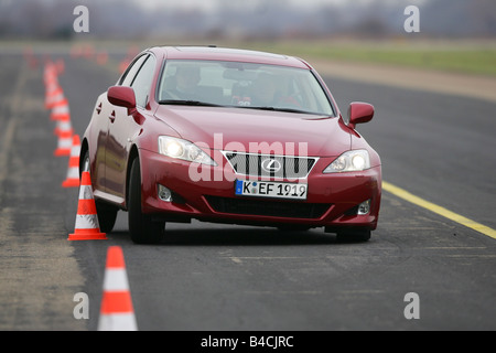 Lexus IS 250, model year 2005-, red, driving, diagonal from the front, frontal view, test track, Pilonen Stock Photo