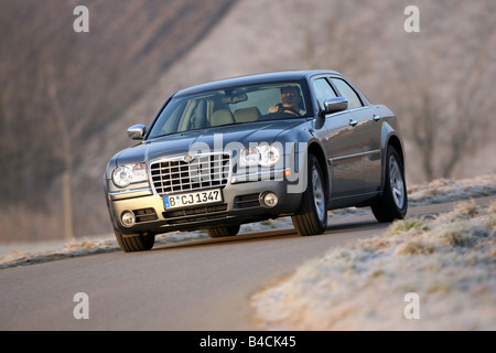 Chrysler 300 C CRD, model year 2005-, silver/anthracite, driving, diagonal from the front, frontal view, country road Stock Photo