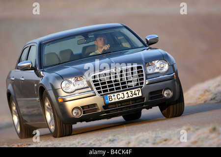 Chrysler 300 C CRD, model year 2005-, silver/anthracite, driving, diagonal from the front, frontal view, country road Stock Photo