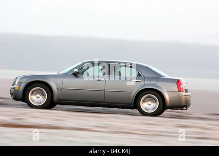 Chrysler 300 C CRD, model year 2005-, silver/anthracite, driving, side view, country road Stock Photo