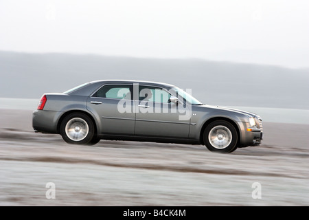 Chrysler 300 C CRD, model year 2005-, silver/anthracite, driving, side view, country road Stock Photo