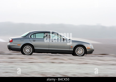 Jaguar S-Type 2.7 D, model year 2004-, silver/anthracite, driving, side view, country road Stock Photo