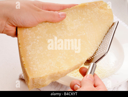 https://l450v.alamy.com/450v/b4ckyt/grating-parmesan-cheese-b4ckyt.jpg