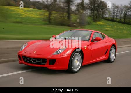 Ferrari 599 GTB, model year 2006-, red, driving, diagonal from the front, frontal view, country road Stock Photo