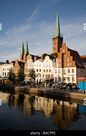 Reflections of buildings in river Lubeck Germany Stock Photo