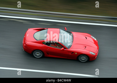 Ferrari 599 GTB Fiorano, model year 2006-, red, driving, side view, test track Stock Photo