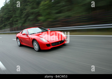 Ferrari 599 GTB Fiorano, model year 2006-, red, driving, diagonal from the front, frontal view, test track Stock Photo