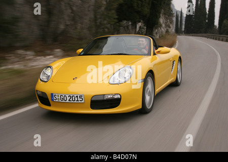 Porsche Boxster Sportpaket, model year 2004-, yellow, driving, diagonal from the front, frontal view, country road, landsapprox. Stock Photo