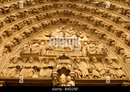 reliefs at the entrance gate to Notre Dame de Paris in Paris France Stock Photo