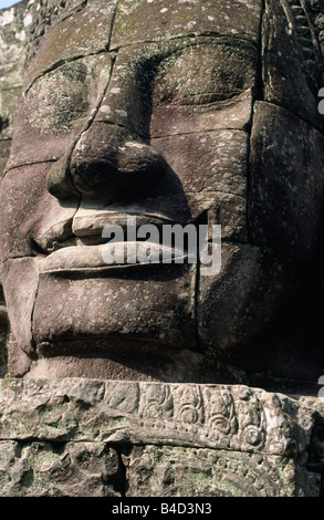 The smile of Angkor. Sculpted from stone, the smiling faces at Bayon temple are a symbol of Angkor, near Siem Reap, Cambodia. Stock Photo