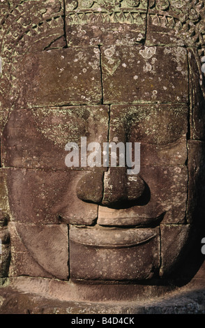 The smile of Angkor. Sculpted from stone, the smiling faces at Bayon temple are a symbol of Angkor, near Siem Reap, Cambodia. Stock Photo